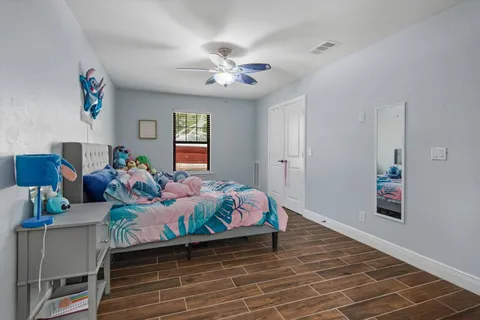a bed room with a bed and a chandelier