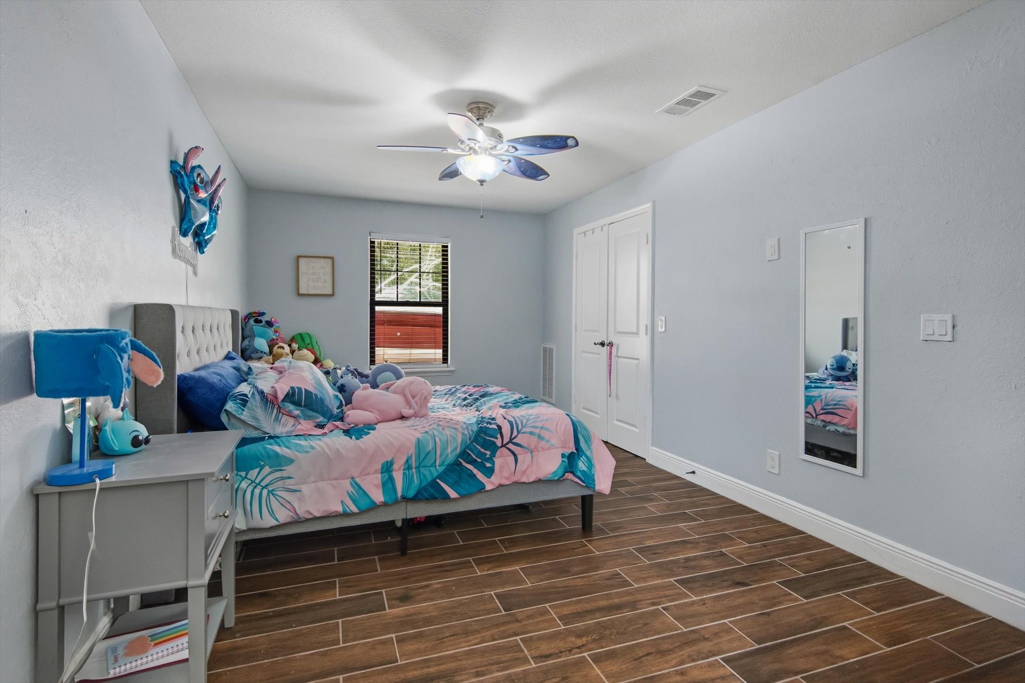 9711 Highway 150 Shepherd, TX 77371 - Photo 37 of 48 a bed room with a bed and a chandelier