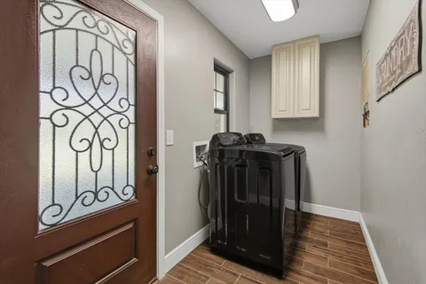 a view of front door with wooden floor