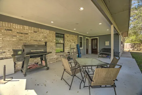 a dining room with furniture and window