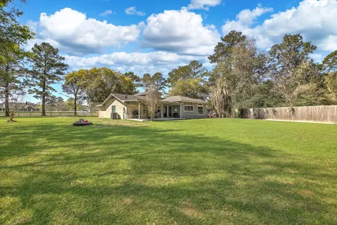 a view of house with a garden