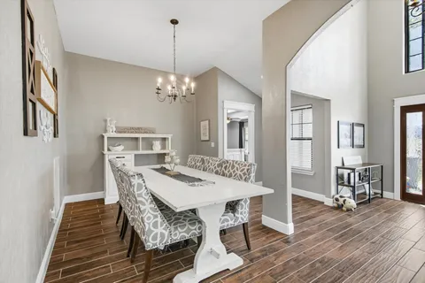 a view of a dining room with furniture and wooden floor