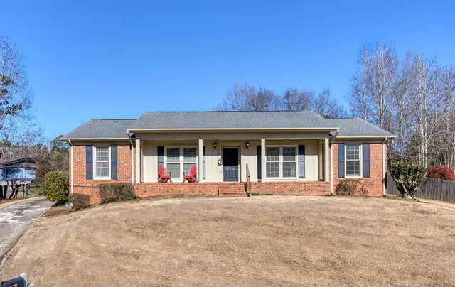 front view of a house with a yard