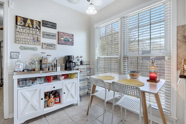 a view of kitchen with refrigerator and window