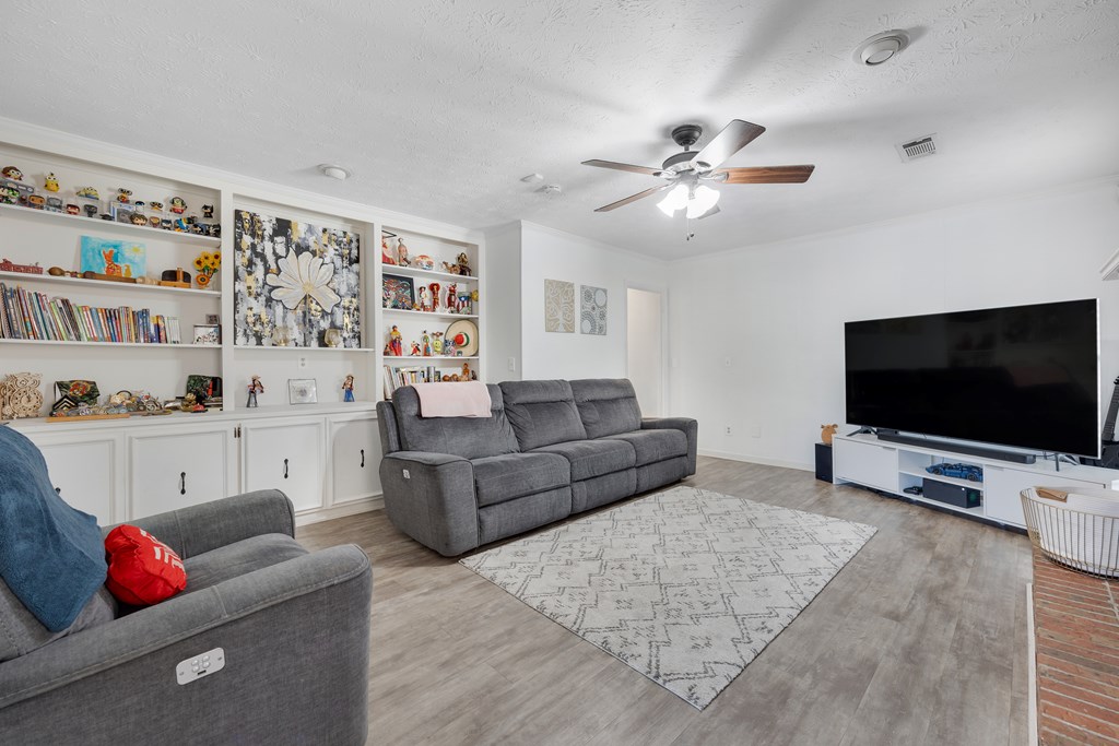 2 Biltmore Court Columbus, GA 31909 - Photo 16 of 29 a living room with furniture and a flat screen tv