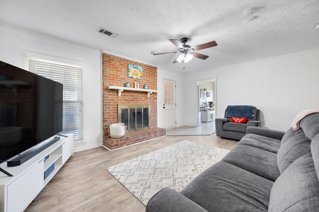 2 Biltmore Court Columbus, GA 31909 - Photo 17 of 29 a living room with furniture and a flat screen tv