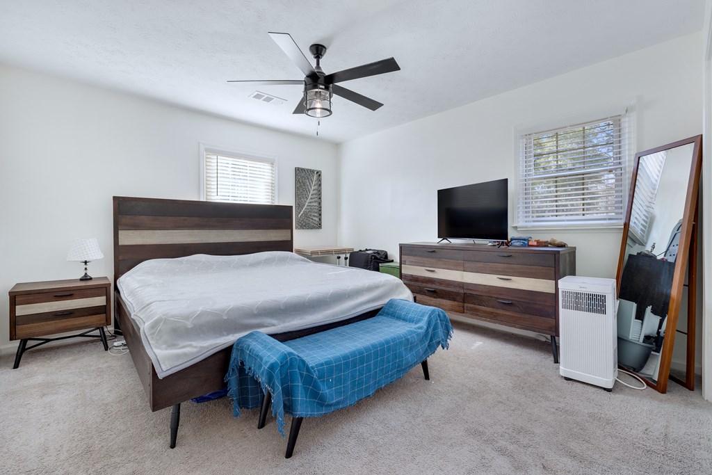 2 Biltmore Court Columbus, GA 31909 - Photo 21 of 29 a bedroom with a bed and a flat screen tv