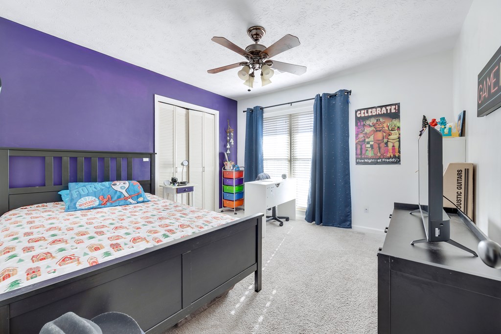 2 Biltmore Court Columbus, GA 31909 - Photo 22 of 29 a bedroom with a bed and a chandelier