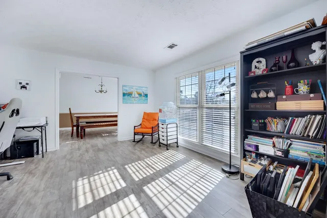 a bedroom with furniture and a book shelf