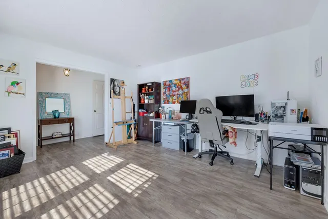 a view of a livingroom with furniture and a flat screen tv