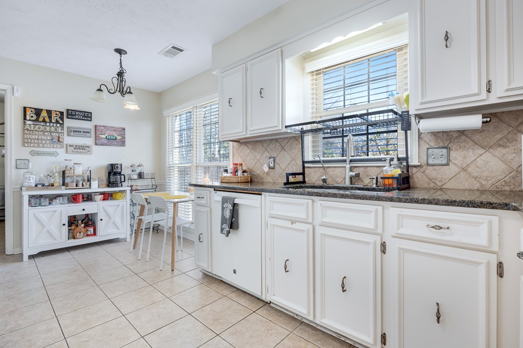 2 Biltmore Court Columbus, GA 31909 - Photo 8 of 29 a kitchen with cabinets and window