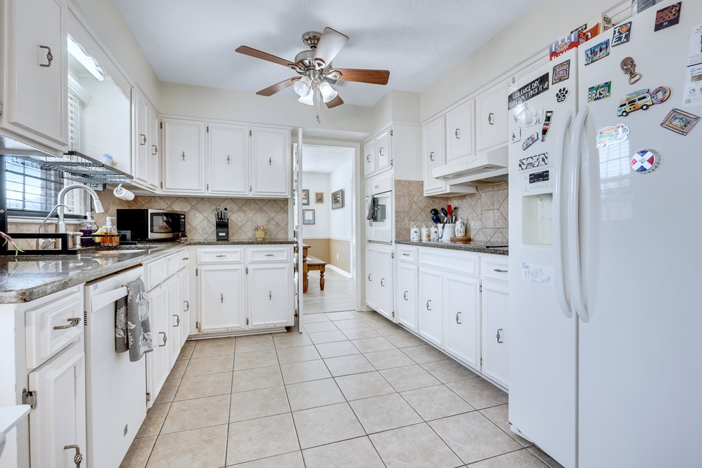 2 Biltmore Court Columbus, GA 31909 - Photo 9 of 29 a kitchen with cabinets and window