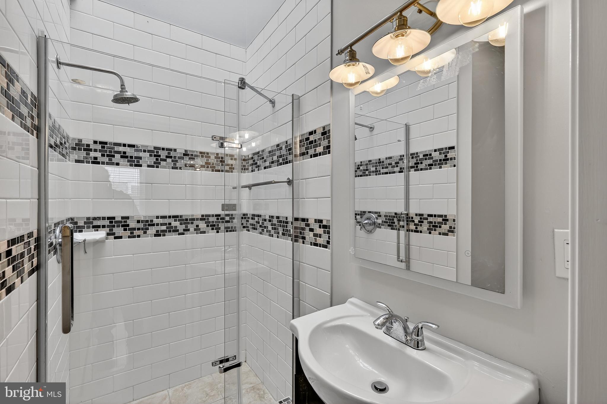 5619 1st Place Northwest, Unit 4 Washington, DC 20011 - Photo 17 of 24 a bathroom with a shower and a sink