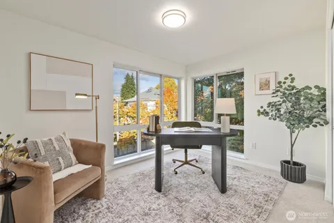 a view of a dining room with furniture window and outside view