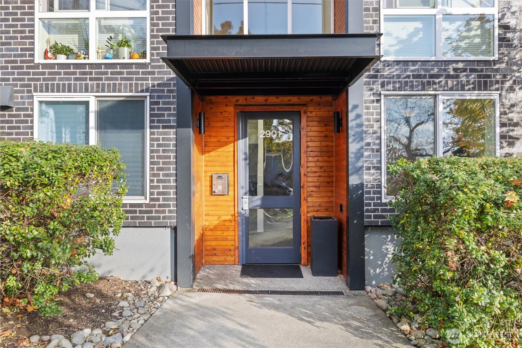 2901 South Jackson Street, Unit 507 Seattle, WA 98144 - Photo 2 of 29 a front view of a house with a garden