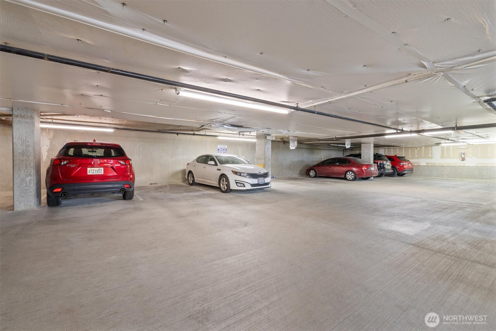 2901 South Jackson Street, Unit 507 Seattle, WA 98144 - Photo 21 of 29 a view of parking garage with cars and