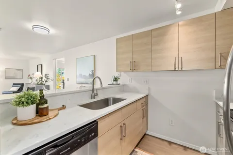a kitchen with a sink and cabinets