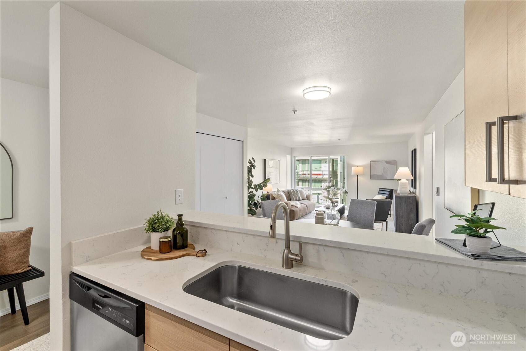 2901 South Jackson Street, Unit 507 Seattle, WA 98144 - Photo 5 of 29 a kitchen with sink and mirror