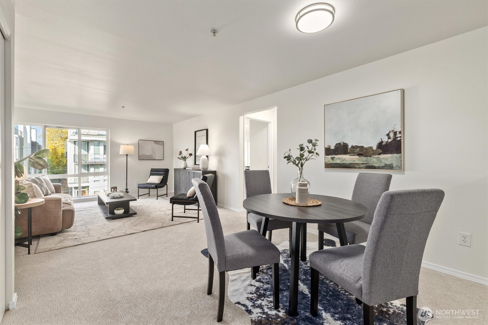 2901 South Jackson Street, Unit 507 Seattle, WA 98144 - Photo 6 of 29 a view of a dining room with furniture and wooden floor