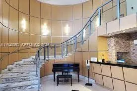 a room with lots of wooden furniture and a window