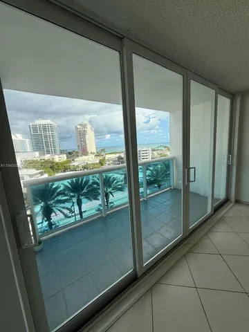 a view of a glass door with a balcony