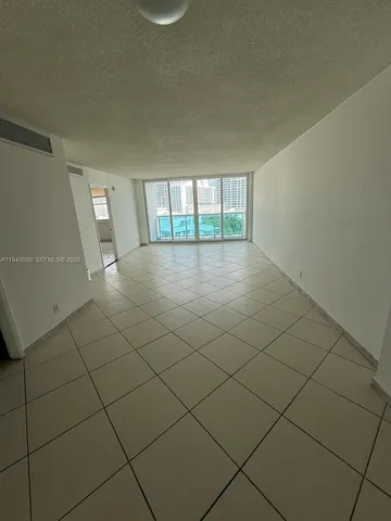a view of a livingroom and window