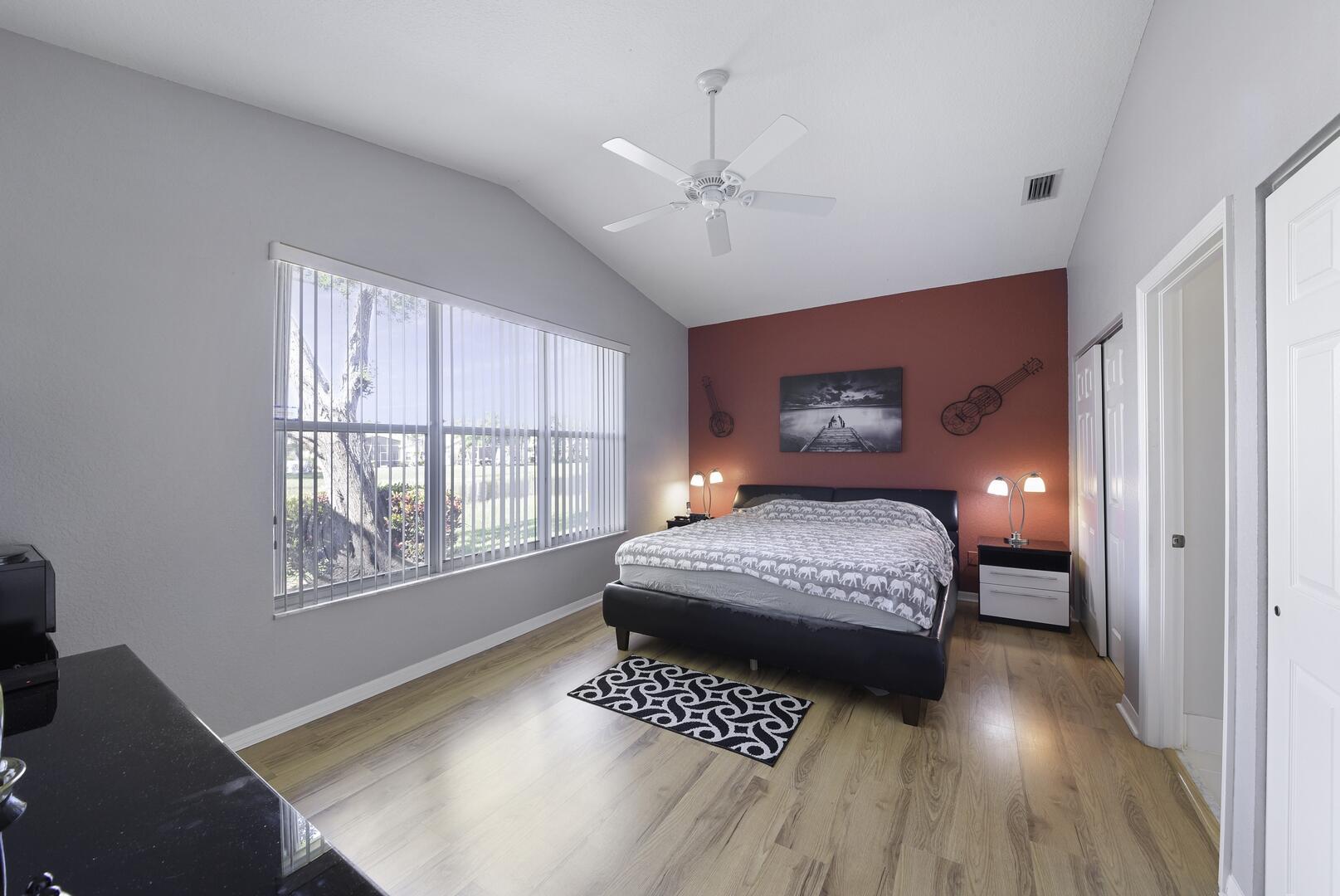 8214 Bellafiore Way Boynton Beach, FL 33472 - Photo 12 of 35 a bedroom with a large bed and a window