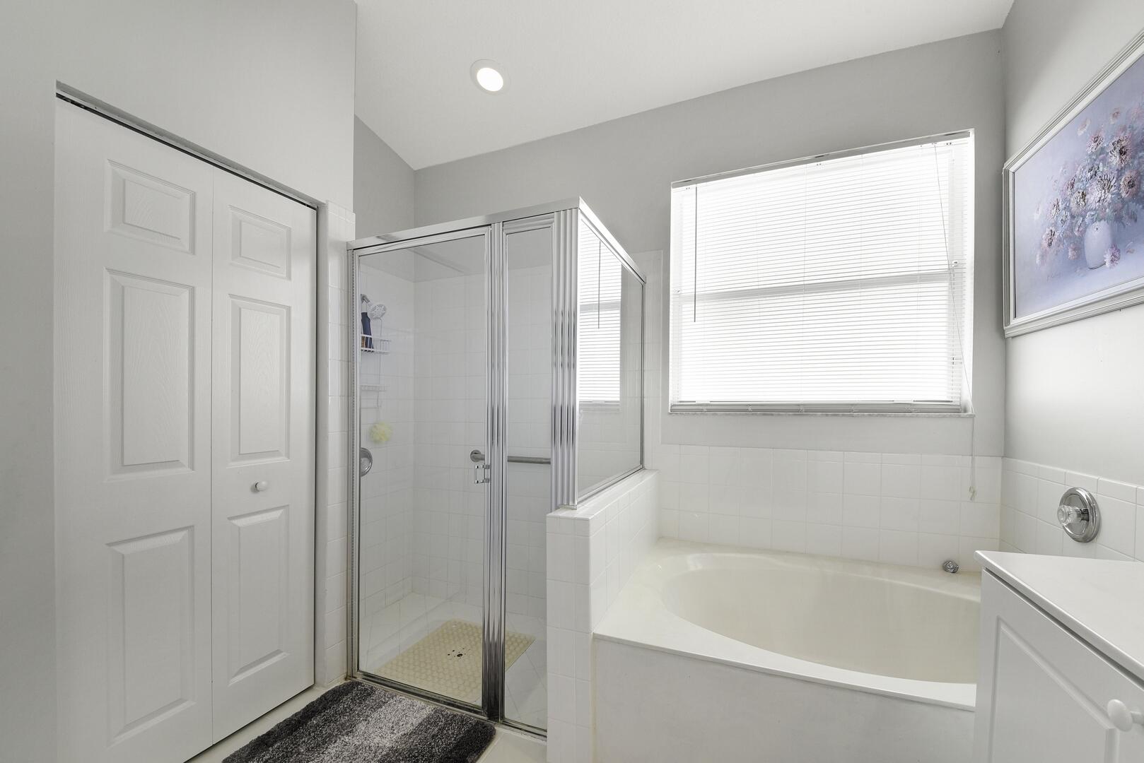 8214 Bellafiore Way Boynton Beach, FL 33472 - Photo 14 of 35 a bathroom with a bathtub and a shower