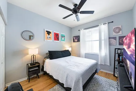 a bathroom with a tub a sink and mirror
