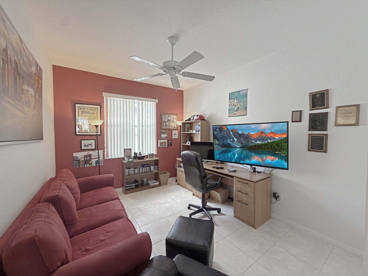 8214 Bellafiore Way Boynton Beach, FL 33472 - Photo 17 of 35 a living room with furniture and a flat screen tv