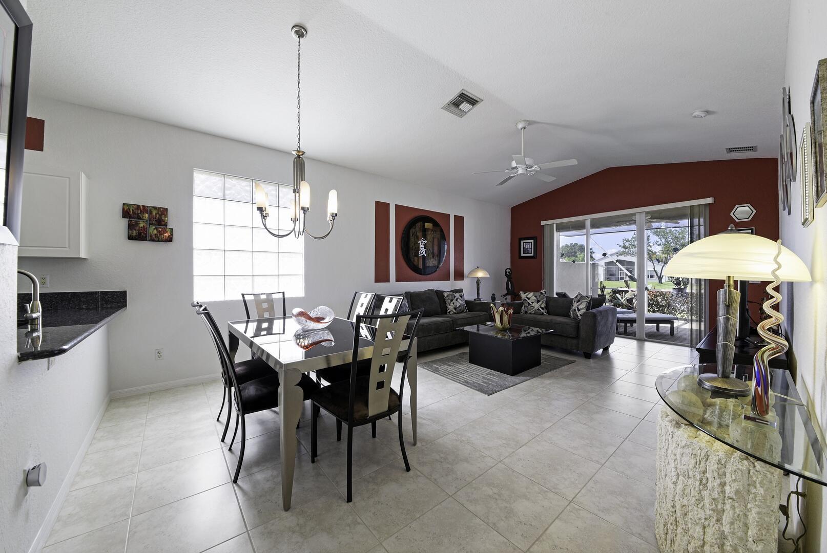 8214 Bellafiore Way Boynton Beach, FL 33472 - Photo 34 of 35 a view of a dining room with furniture window and outside view