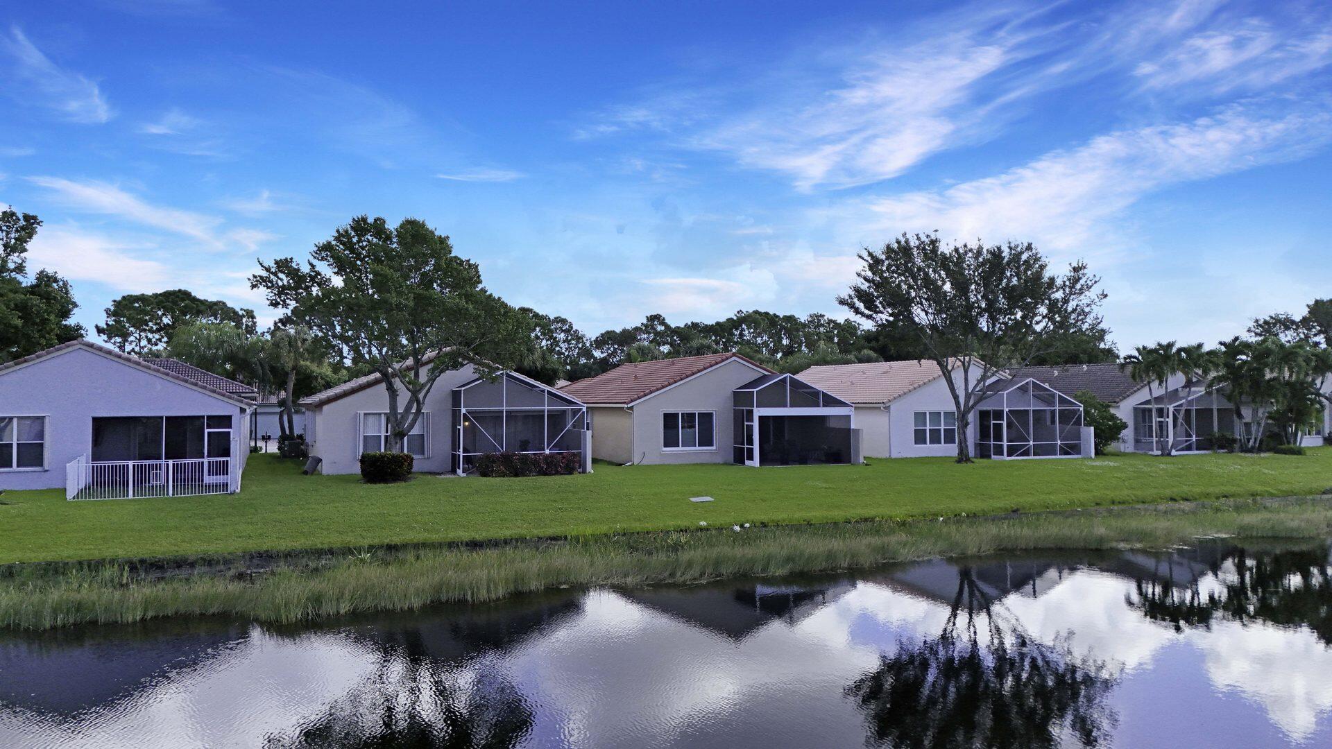 8214 Bellafiore Way Boynton Beach, FL 33472 - Photo 22 of 35 a front view of a house with garden