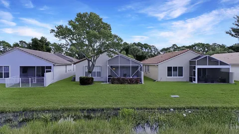 a view of a lake with houses in the back