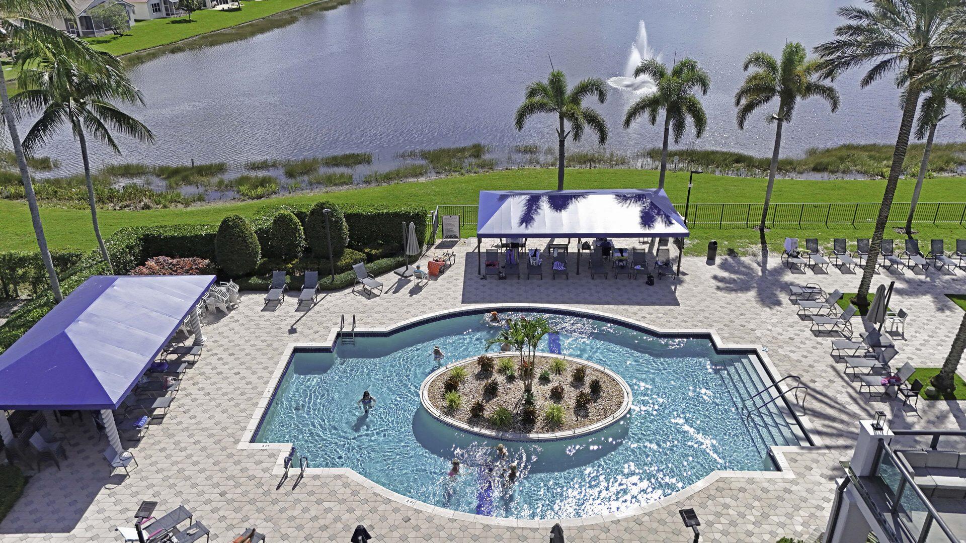 8214 Bellafiore Way Boynton Beach, FL 33472 - Photo 30 of 35 an aerial view of a house with swimming pool and a yard