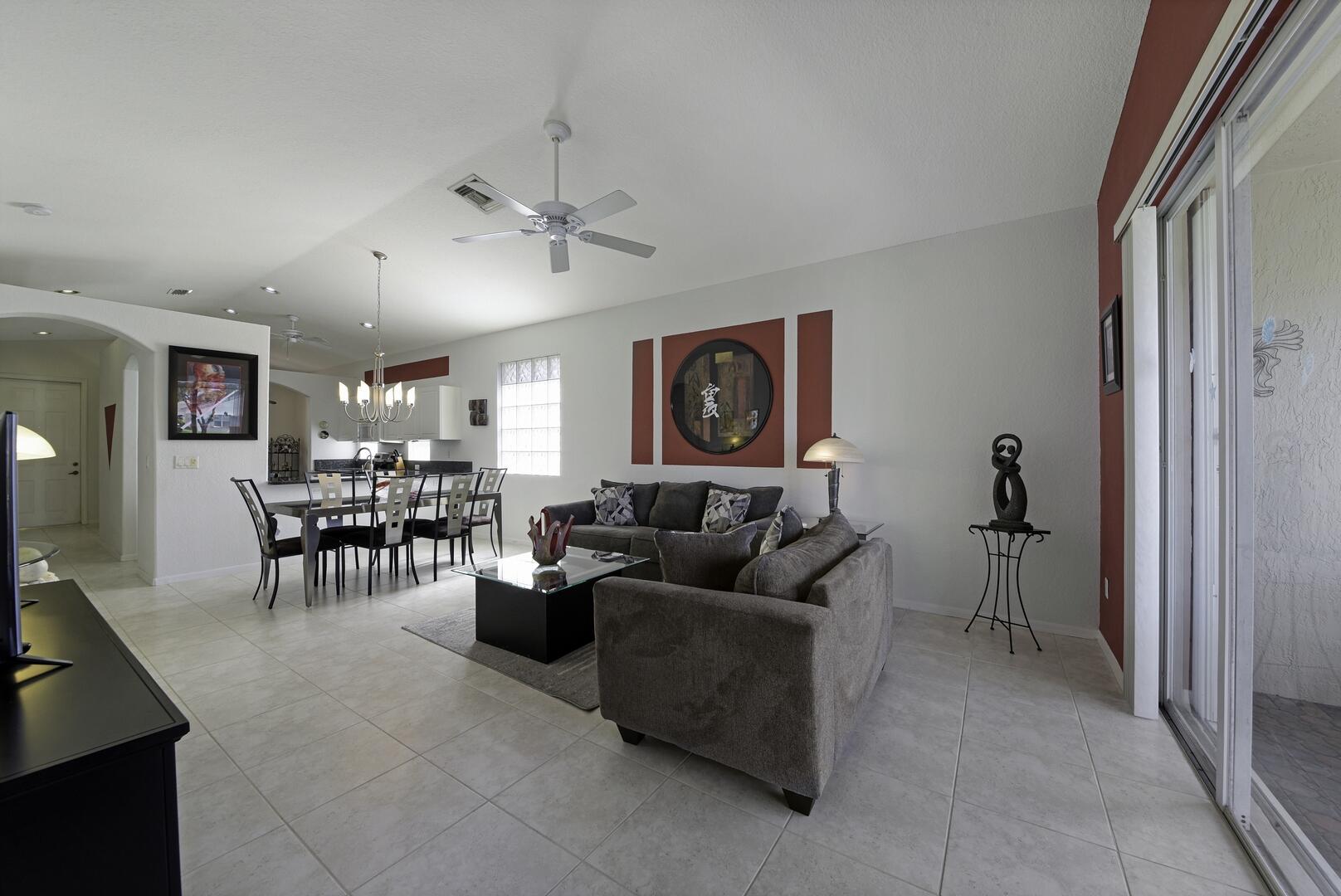 8214 Bellafiore Way Boynton Beach, FL 33472 - Photo 4 of 35 a living room with furniture and a flat screen tv