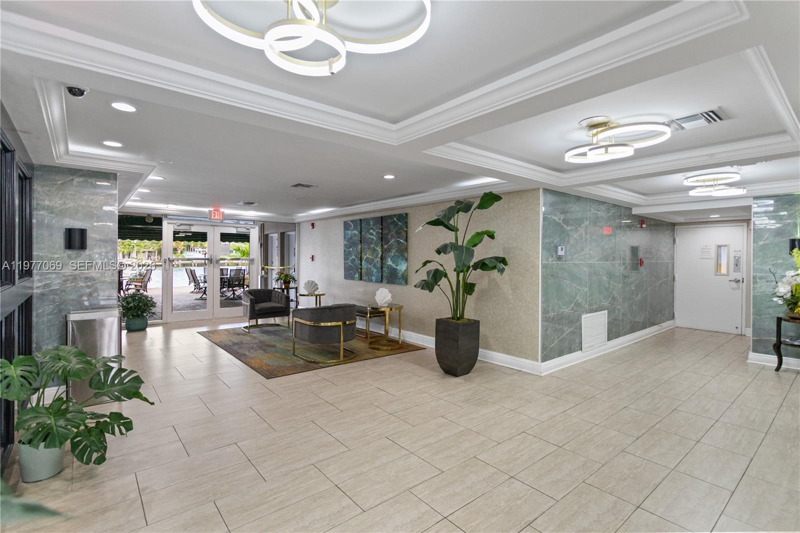 2611 North Riverside Drive, Unit 901 Pompano Beach, FL 33062 - Photo 22 of 27 a view of a lobby with furniture