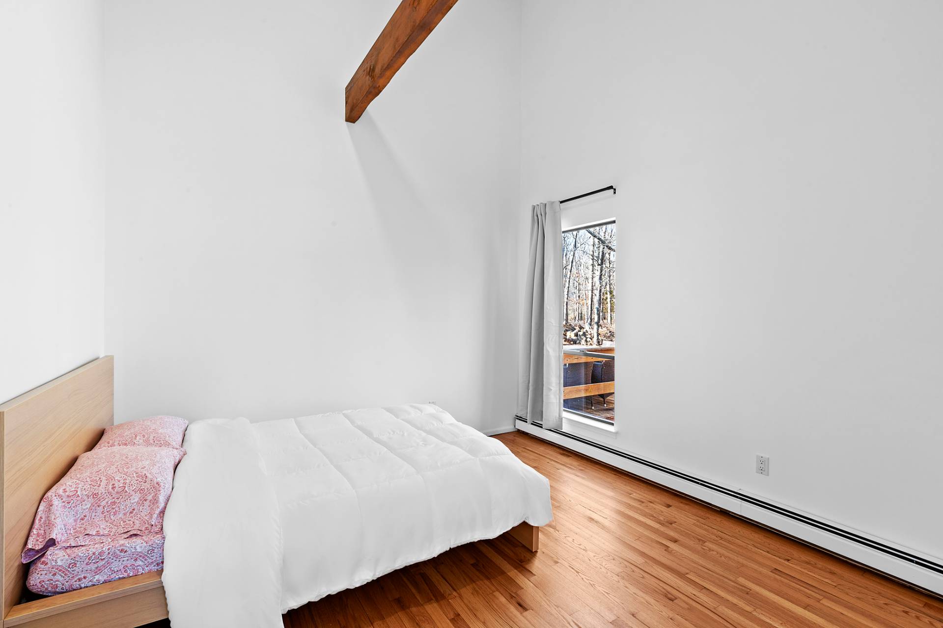 74 Hildreth Place East Hampton, NY 11937 - Photo 11 of 14 a bedroom with a bed and a window