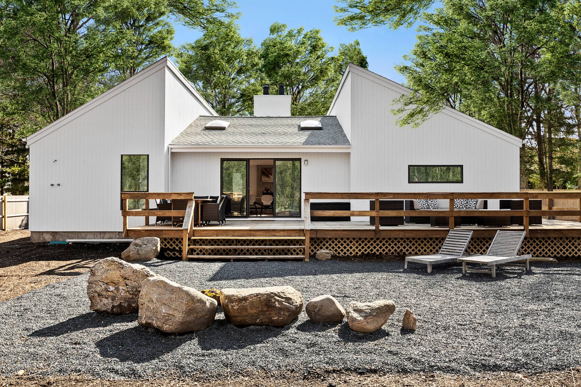 74 Hildreth Place East Hampton, NY 11937 - Photo 14 of 14 a front view of a house with a garden and patio