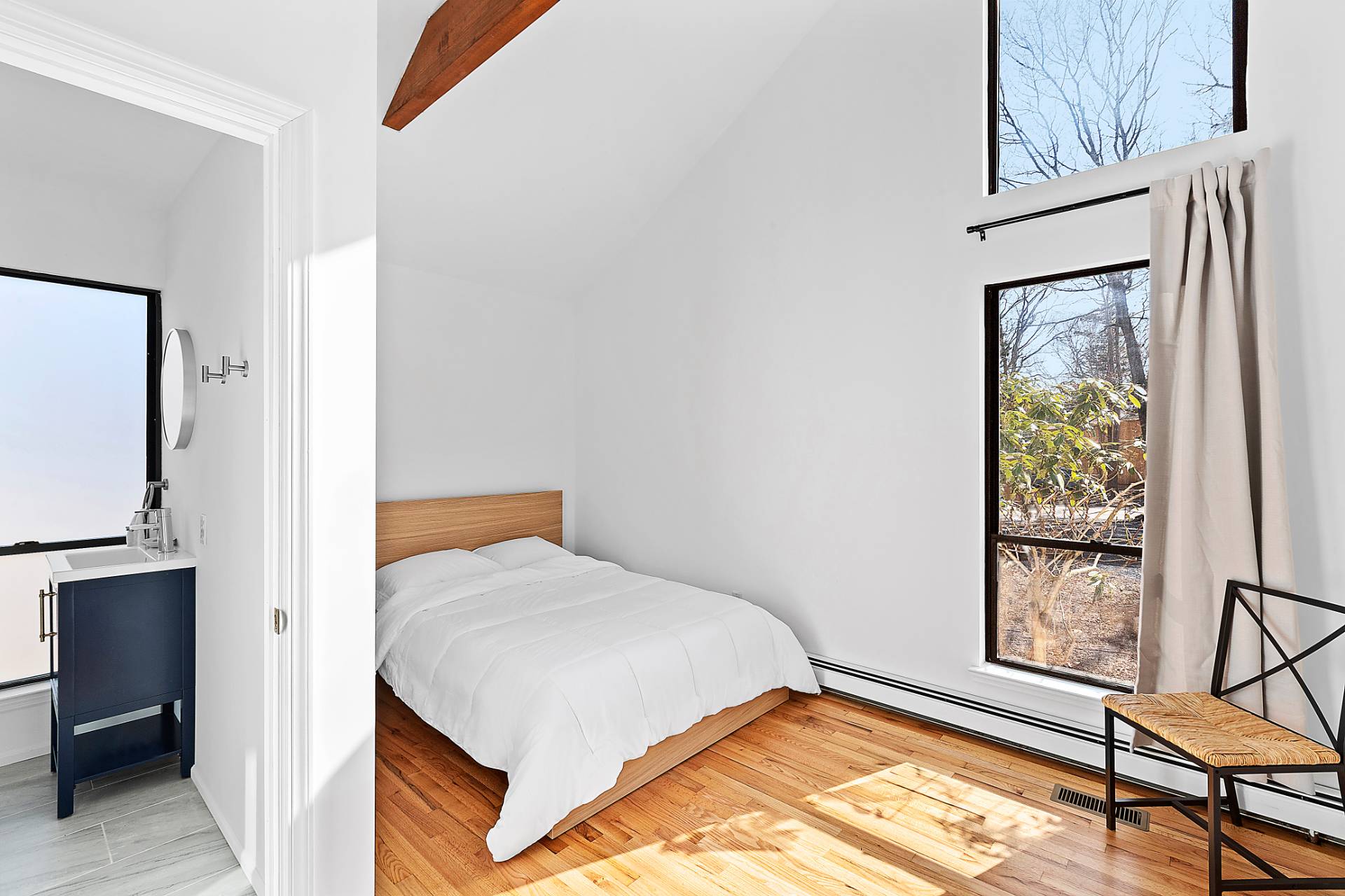 74 Hildreth Place East Hampton, NY 11937 - Photo 9 of 14 a bedroom with a bed and a window