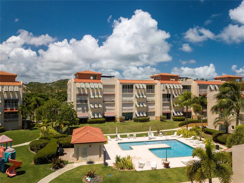 Harbour Point Harbour Point, Unit 304B Humacao, PR 00791 - Photo 1 of 1 a view of a swimming pool with sitting area