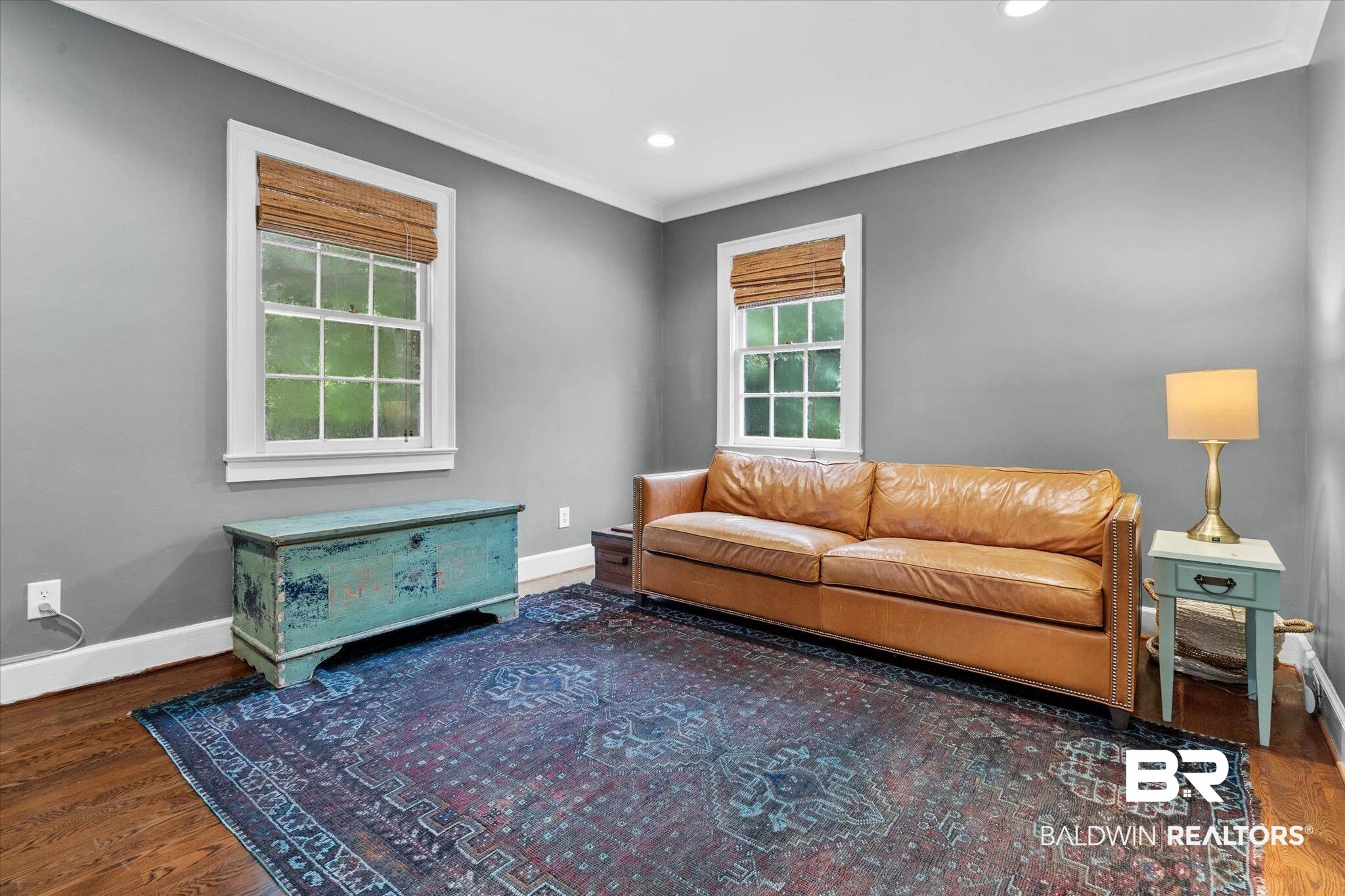 3863 Old Shell Road Mobile, AL 36608 - Photo 5 of 48 Hardwood flooring throughout this room, featuring two large windows with natural light, crown molding, and recessed lighting