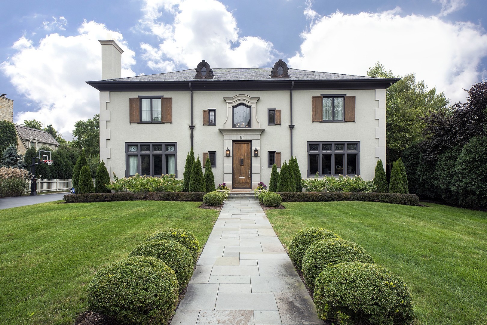 127 Old Green Bay Road Winnetka, IL 60093 - Photo 1 of 33 a front view of a house with garden