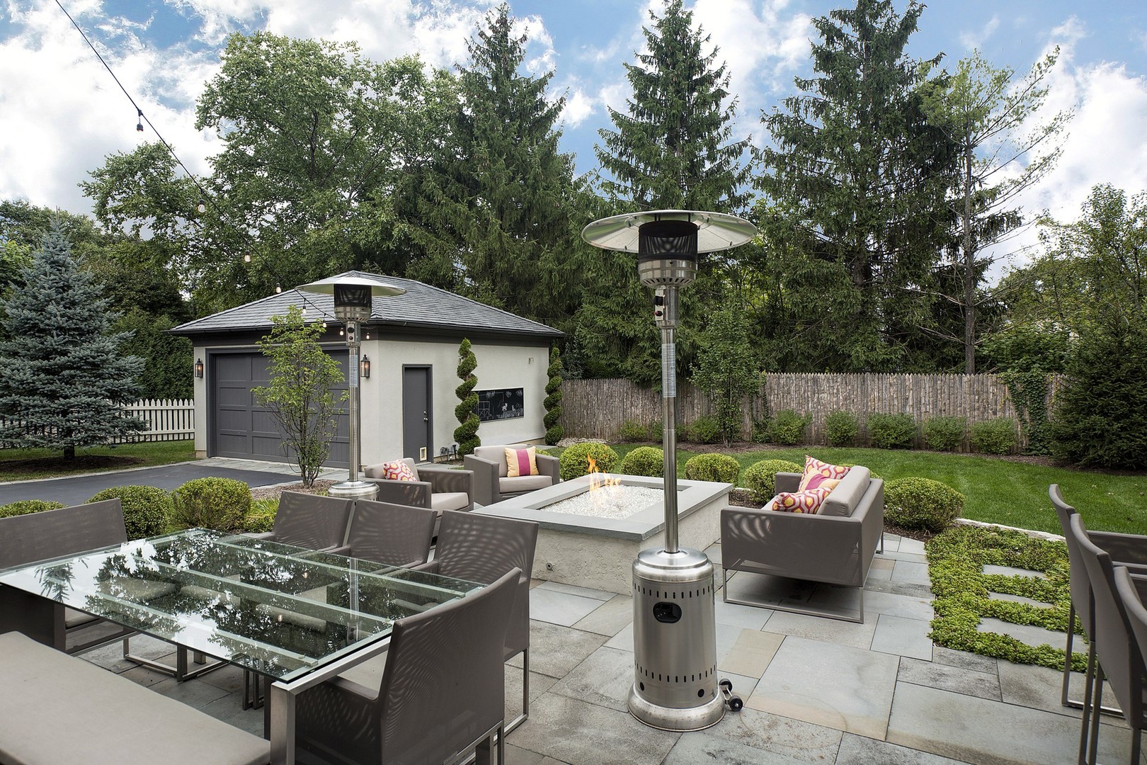 127 Old Green Bay Road Winnetka, IL 60093 - Photo 27 of 33 a view of a patio with couches chairs and a fire pit