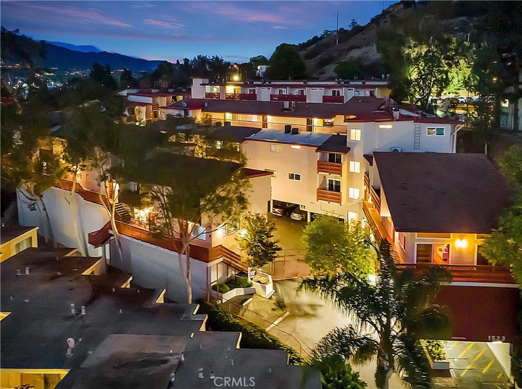 1523 East Windsor Road, Unit 208A Glendale, CA 91205 - Photo 1 of 27 an aerial view of residential houses with outdoor space
