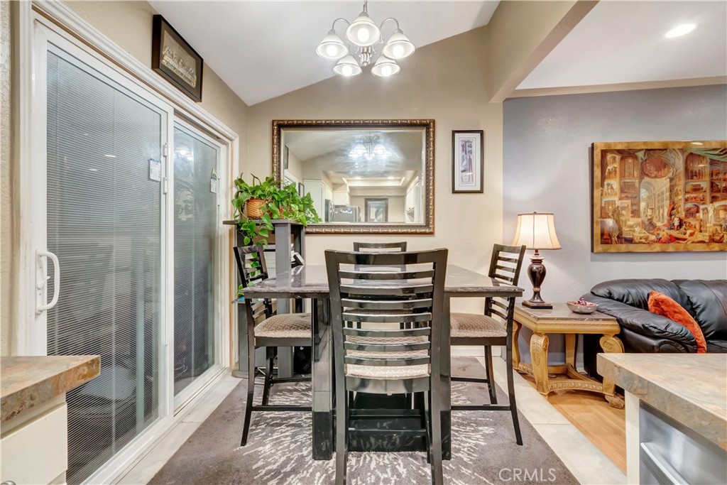 1523 East Windsor Road, Unit 208A Glendale, CA 91205 - Photo 12 of 27 a view of a dining room with furniture and a chandelier