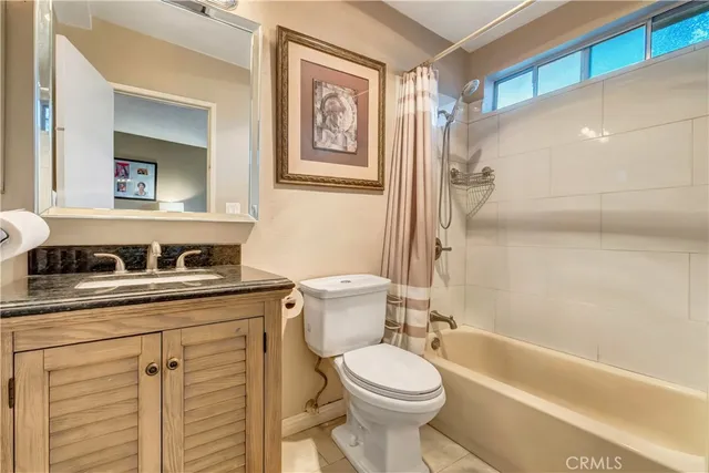 a bedroom with furniture and a mirror