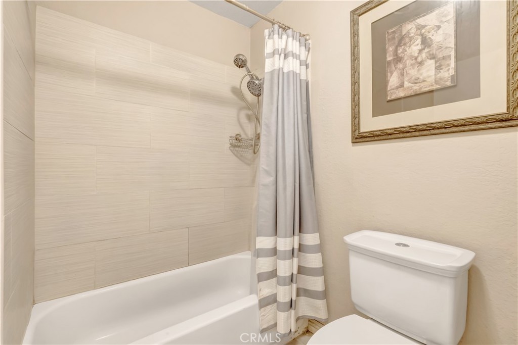 1523 East Windsor Road, Unit 208A Glendale, CA 91205 - Photo 21 of 27 a white toilet sitting next to a bath tub and a shower