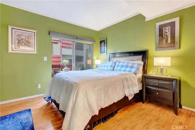 a bedroom with a bed and a cabinets