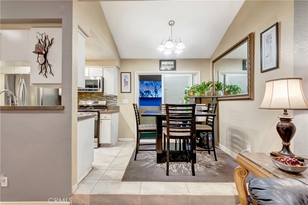 1523 East Windsor Road, Unit 208A Glendale, CA 91205 - Photo 7 of 27 a view of a dining room with furniture and chandelier