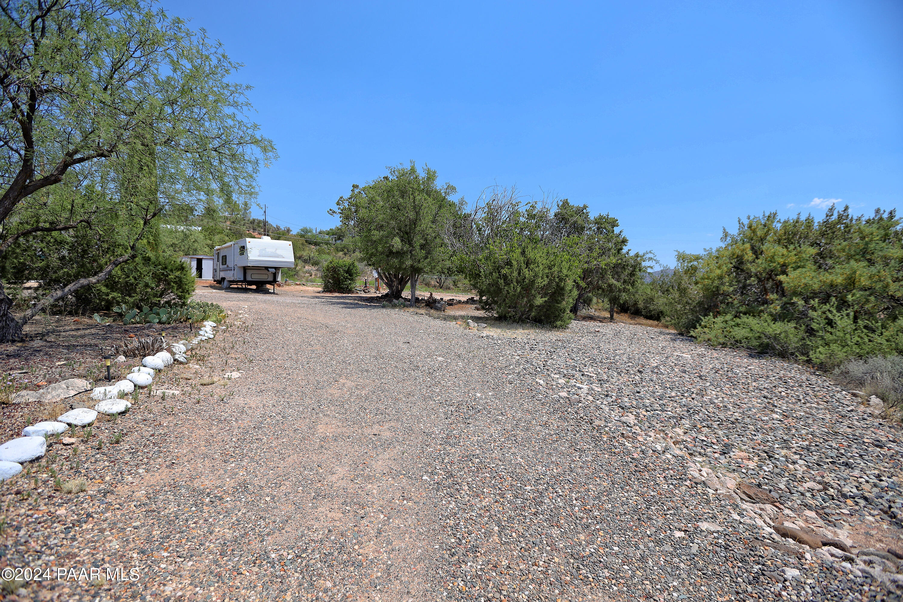 4595 Quail Hollow Road Rimrock, AZ 86335 - Photo 18 of 30 a view of a dirt road with a building in the background